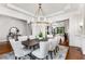 Formal dining room showcasing hardwood floors and modern chandelier at 56 Mount Paran Rd, Atlanta, GA 30327