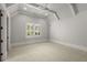 Spacious bedroom with neutral walls and plush carpeting at 56 Mount Paran Rd, Atlanta, GA 30327