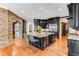 Gourmet kitchen with dark cabinetry, granite countertops and large island at 56 Mount Paran Rd, Atlanta, GA 30327
