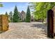 Gated entry to home with brick driveway and landscaping at 56 Mount Paran Rd, Atlanta, GA 30327