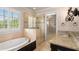Spa-like bathroom with soaking tub, walk-in shower, and granite vanity at 56 Mount Paran Rd, Atlanta, GA 30327