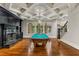 Basement game room featuring a pool table, hardwood floors, and a coffered ceiling at 56 Mount Paran Rd, Atlanta, GA 30327