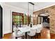 Elegant dining room with chandelier and access to backyard patio at 56 Mount Paran Rd, Atlanta, GA 30327