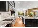Modern kitchen with gas range, custom backsplash and breakfast area at 56 Mount Paran Rd, Atlanta, GA 30327