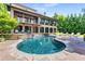 Inviting kidney-shaped pool with flagstone decking and a water feature at 56 Mount Paran Rd, Atlanta, GA 30327