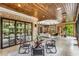 Sunroom with seating area and glass doors leading outside at 56 Mount Paran Rd, Atlanta, GA 30327