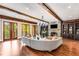 Finished basement with a curved sectional sofa and a fireplace at 56 Mount Paran Rd, Atlanta, GA 30327