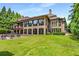 Brick house exterior with a large backyard and lush landscaping at 56 Mount Paran Rd, Atlanta, GA 30327