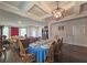 Elegant dining room featuring a large table, wooden chairs, and hardwood floors at 213 Janney Cir, Mcdonough, GA 30253