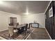 Finished basement dining room with dark wood table and chairs at 213 Janney Cir, Mcdonough, GA 30253