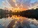 Stunning lakefront sunset reflection at 2646 Lakeshore Ne Dr, Conyers, GA 30012