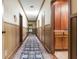 Long hallway with wood wall paneling and skylight at 4370 Harris Trl, Atlanta, GA 30327