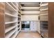 Well-organized pantry with ample shelving and herringbone floors at 4370 Harris Trl, Atlanta, GA 30327