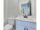 Clean bathroom with white vanity, mirror, toilet, and modern fixtures at 1264 Six Sisters St, Dacula, GA 30019