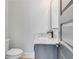Small bathroom with single vanity, toilet, and modern fixtures at 1264 Six Sisters St, Dacula, GA 30019