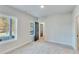 Bright bedroom with large windows, carpeted floors, and neutral walls at 1264 Six Sisters St, Dacula, GA 30019