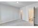 Spacious bedroom with plush carpet, en-suite bathroom, and ample natural light at 1264 Six Sisters St, Dacula, GA 30019