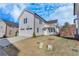 Modern farmhouse-style home with a two-car garage and a well-maintained lawn at 1264 Six Sisters St, Dacula, GA 30019