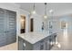 Kitchen with large island, granite countertops, and view of dining area at 1264 Six Sisters St, Dacula, GA 30019