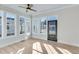 Bright sunroom with many windows and hardwood floors at 1264 Six Sisters St, Dacula, GA 30019