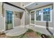Back patio with brick steps, concrete floor, and light green door at 1274 Six Sisters St, Dacula, GA 30019