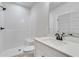 White bathroom featuring a shower, toilet, and vanity at 1274 Six Sisters St, Dacula, GA 30019