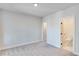 Empty bedroom with carpet flooring and an ensuite bathroom at 1274 Six Sisters St, Dacula, GA 30019