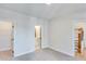 Spacious bedroom with carpet, ensuite bathroom, and walk-in closet at 1274 Six Sisters St, Dacula, GA 30019