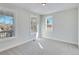 Bright bedroom with large windows offering scenic views and gray carpeting at 1274 Six Sisters St, Dacula, GA 30019