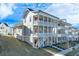 Three-story house with double balconies and landscaping at 1274 Six Sisters St, Dacula, GA 30019