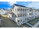 Stunning three-story home with double-decker balconies and a landscaped yard at 1274 Six Sisters St, Dacula, GA 30019