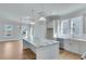 White kitchen with large island and stainless steel appliances at 1274 Six Sisters St, Dacula, GA 30019