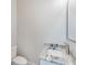 Powder room with marble countertop and a modern sink at 1274 Six Sisters St, Dacula, GA 30019