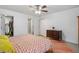 Main bedroom with a dresser and access to a bathroom and closet at 2191 Rockbridge Rd # 1601, Stone Mountain, GA 30087