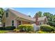 Tan and brick exterior of home with landscaping at 2191 Rockbridge Rd # 1601, Stone Mountain, GA 30087