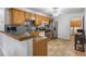 Kitchen with wood cabinets, granite counters, and stainless steel appliances at 2191 Rockbridge Rd # 1601, Stone Mountain, GA 30087