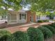 Ranch-style home with brick and siding, covered porch, and landscaping at 223 Windcroft Nw Cir, Acworth, GA 30101