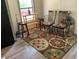 Cozy dining area with wood table and chairs, complemented by elegant curtains and a chandelier at 160 Scott Rd, Canton, GA 30115