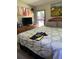 Spacious bedroom with king-size bed, large window, and wood dresser at 160 Scott Rd, Canton, GA 30115