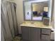 Clean bathroom with gray vanity, shower, and mirror reflecting the bedroom at 160 Scott Rd, Canton, GA 30115