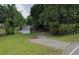 Gravel driveway entrance to property with trees at 160 Scott Rd, Canton, GA 30115