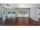 Bright dining room with hardwood floors, access to deck, and kitchen view at 1274 Bramlett Shoals Rd, Lawrenceville, GA 30045