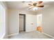 Bedroom with ceiling fan and access to bathroom and closet at 3440 Homeward Trl, Ellenwood, GA 30294