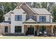 Modern farmhouse style home with brick and white siding, black windows, and metal roof at 1118 Low Water Crossing Nw, Acworth, GA 30101