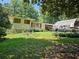 House exterior with yard and carport at 3476 Cooper St, Lithia Springs, GA 30122