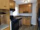 Galley kitchen with wood cabinets and appliances at 2341 Baywood Se Dr, Atlanta, GA 30315