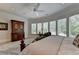 Primary bedroom with bay window, ceiling fan, and ensuite bath at 962 Chattooga Trce, Suwanee, GA 30024