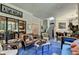 Open living space with leather seating and a view into the wine cellar at 962 Chattooga Trce, Suwanee, GA 30024