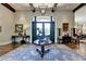 Grand entryway with hardwood floors, statement chandelier, and large windows at 962 Chattooga Trce, Suwanee, GA 30024