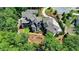 Multi-level home with stone accents and landscaped grounds at 962 Chattooga Trce, Suwanee, GA 30024